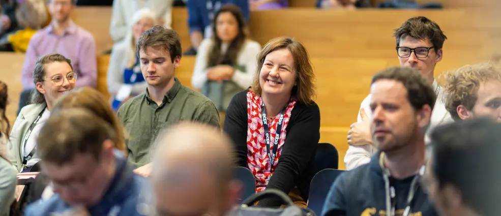 ECPR participants smiling and engaging with a lecture